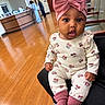 Ameri joined the competition — help win amazing prizes! baby, infant, child, portrait, sitting, pink_bow, headband, patterned_outfit, minnie_mouse, onesie, socks, chair, waiting_room, indoor, wooden_floor, wide_eyes, curious, fashion, adorable, photography