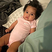 Azrique joined the competition — help win amazing prizes! baby, bed, blanket, child, comfort, cute, eyes, face, hair, indoor, infant, looking, nike_logo, person, pillow, pink_onesie, portrait, relaxing, skin, toddler