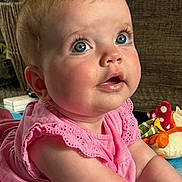 Daisy-Mai joined the competition — help win amazing prizes! baby, child, pink_dress, blue_eyes, drool, playmat, soft_toys, indoor, curious, infant, cute, face, portrait, person, baby_girl, floor, colorful, expression, mouisture, young