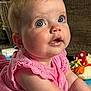 baby, child, pink_dress, blue_eyes, drool, playmat, soft_toys, indoor, curious, infant, cute, face, portrait, person, baby_girl, floor, colorful, expression, mouisture, young