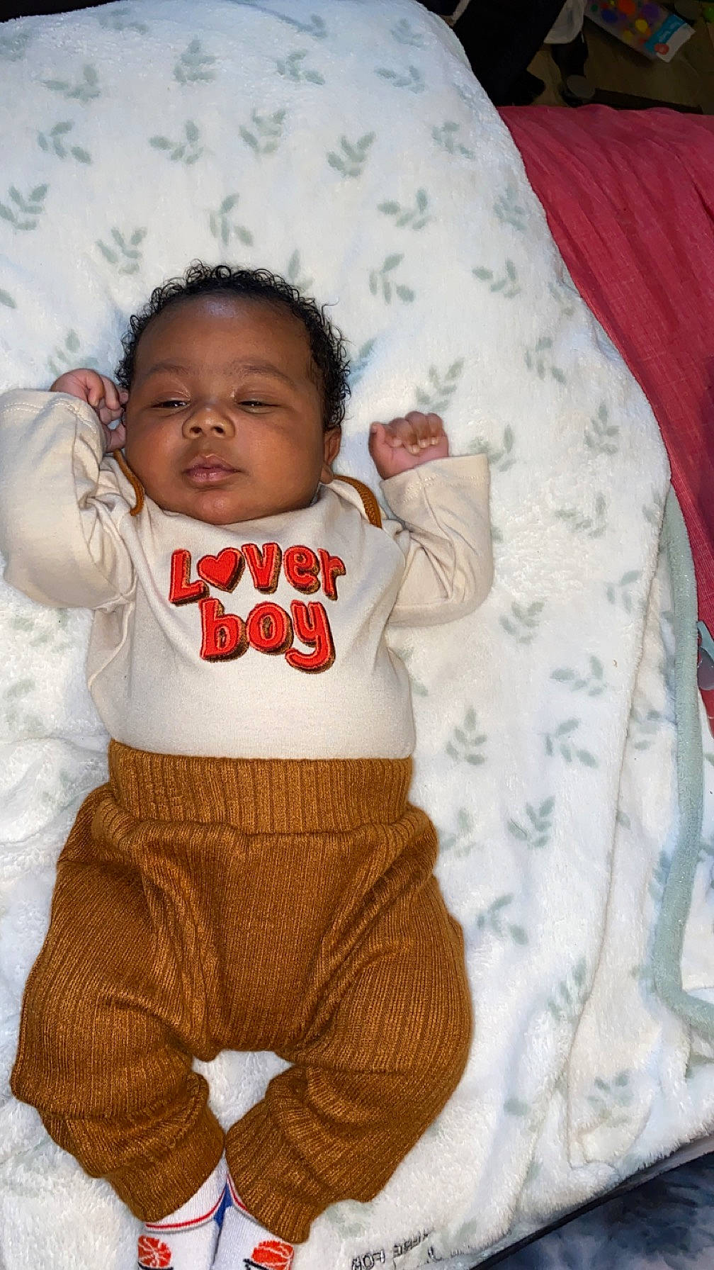 Carlos joined the competition — help win amazing prizes! arm, baby, baby_sleeping, baby_toddler_clothing, cheek, child, comfort, football, happy, human, linens, nose, outerwear, pattern, person, skin, sleeve, t_shirt, textile, toddler