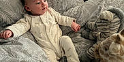 Kairo joined the competition — help win amazing prizes! baby, infant, bed, bedding, pillow, plush_toy, giraffe, zebra, sleepwear, onesie, pattern, headboard, soft_toys, indoor, cute, child, resting, comfort, young, blanket