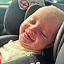 Kairo is registered to the contest to win money with this photo: baby, smiling, car_seat, child, infant, seatbelt, joyful, closeup, face, head, clothing, sunlight, window, vehicle, safe, seat, child_safety, happy, transportation, young