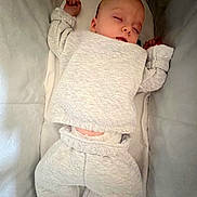 Kairo is registered to the contest to win money with this photo: baby, sleeping, pajamas, crib, child, infant, cozy, soft, relaxed, cute, young_child, resting, cushion, indoors, one_person, face, head, arms, legs, comfort