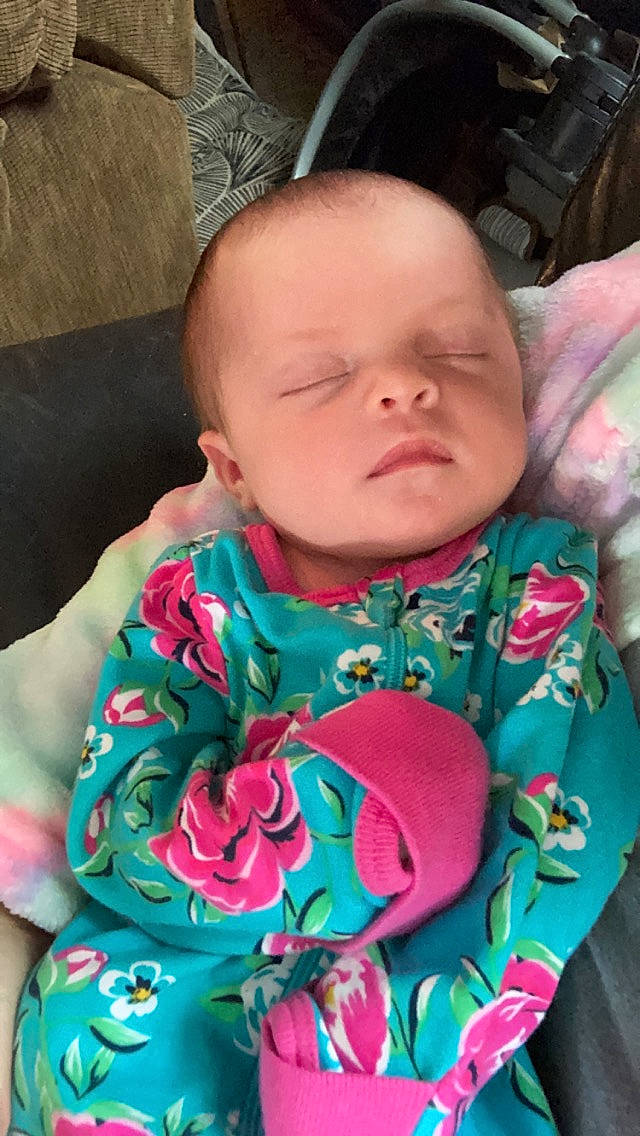 Lylah is registered to the contest to win money with this photo: baby, baby_toddler_clothing, cheek, child, chin, collar, comfort, dress, eye, face, happy, head, iris, lip, mouth, neck, person, pink, skin, sleeve