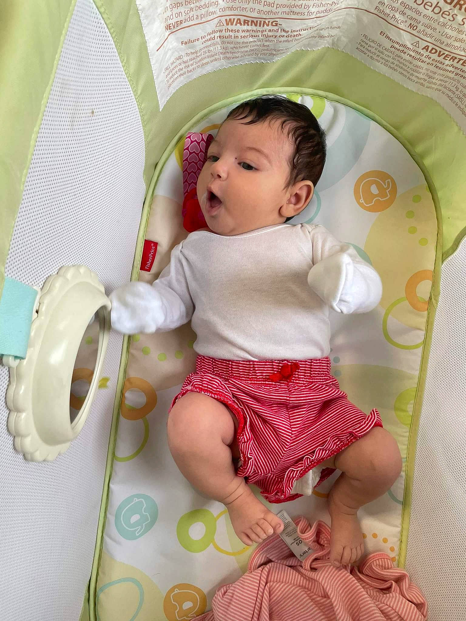 Ana is registered to the contest to win money with this photo: baby, baby_products, baby_toddler_clothing, beauty, child, comfort, happy, linens, magenta, pattern, person, pink, product, room, sitting, skin, sleeve, sock, surprise, textile