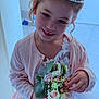 child, girl, princess, tiara, flower_bouquet, smile, dress, lace, pink_cardigan, nail_polish, curly_hair, indoor, portrait, happy, cute, young, celebration, formal_wear, person, holding