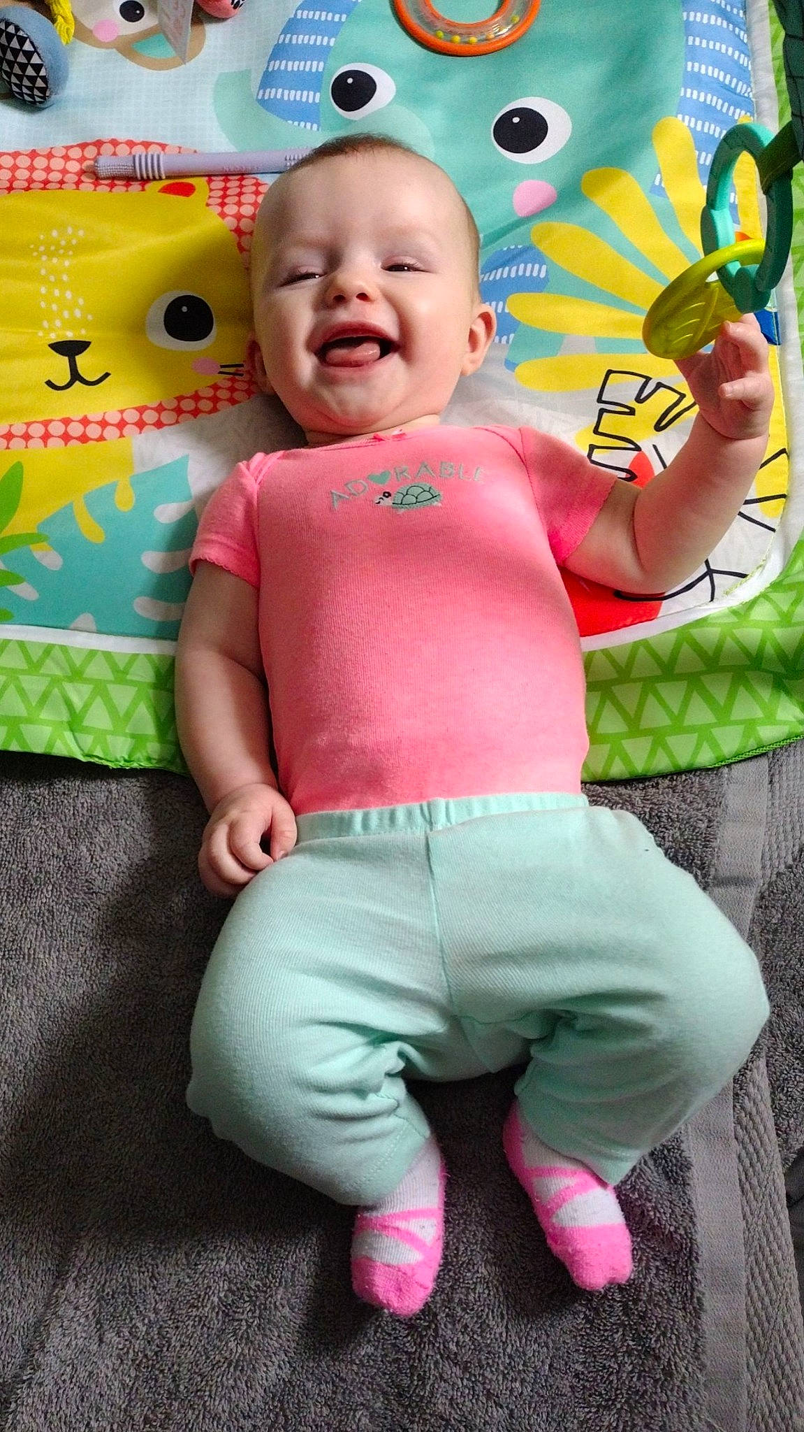 Aurora joined the competition — help win amazing prizes! baby, baby_toddler_clothing, cheek, child, fun, gesture, green, happy, head, human_body, magenta, person, pink, product, skin, sleeve, smile, t_shirt, textile, thumb