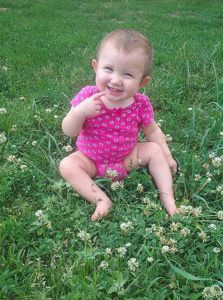 Addilyn River Mae Warner joined the competition — help win amazing prizes! baby, baby_toddler_clothing, child, flower, grass, grass_family, grassland, groundcover, happy, joy, lawn, leaf, mammal, meadow, people_in_nature, person, petal, pink, plant, smile