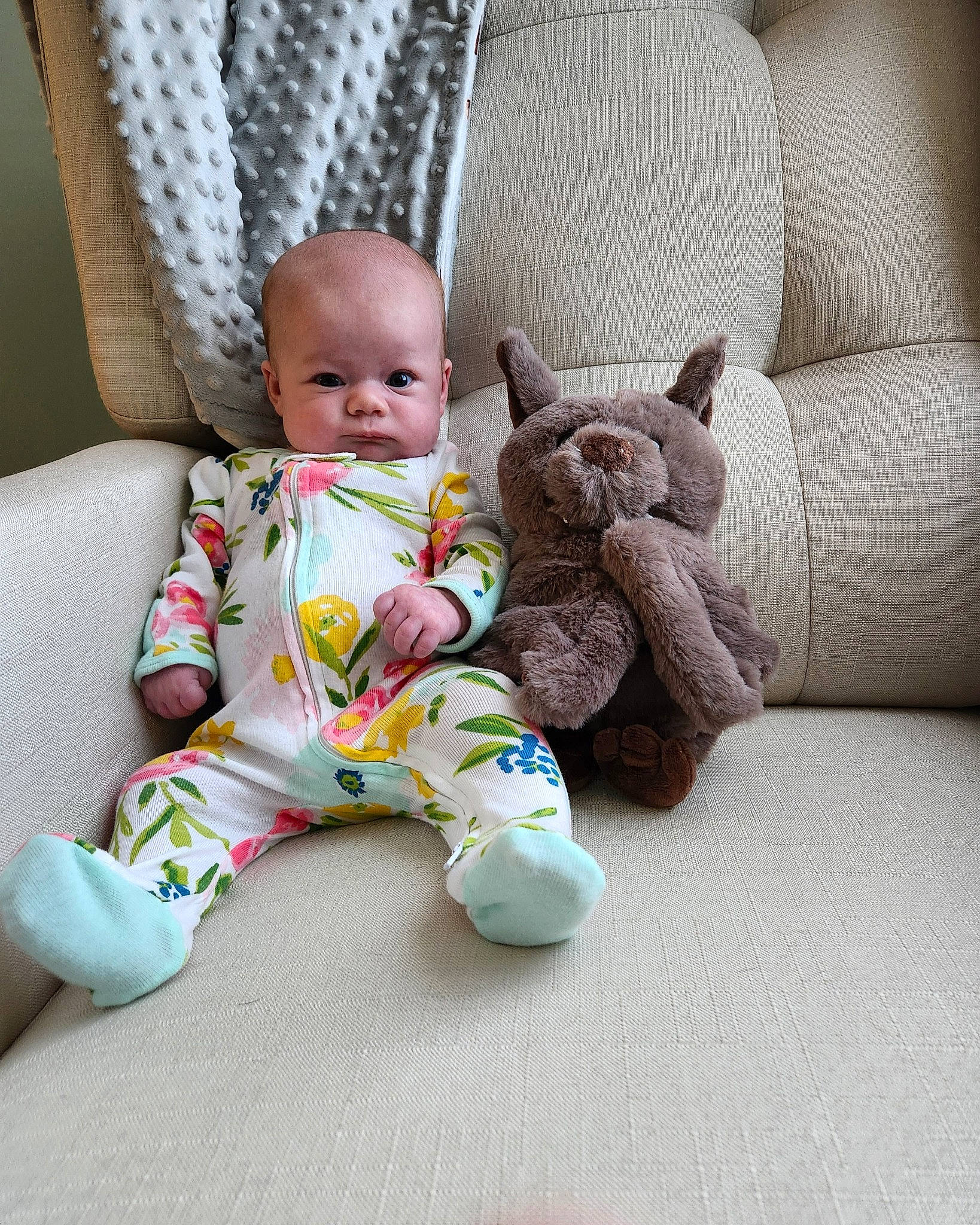 Violet is registered to the contest to win money with this photo: baby, baby_products, baby_sleeping, baby_toddler_clothing, chair, child, comfort, couch, flooring, foot, furniture, leg, linens, person, product, room, sitting, skin, stuffed_toy, toddler