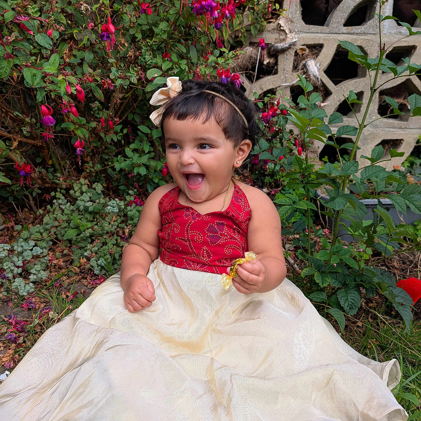 Gianna Tess is registered to the contest to win money with this photo: candy, celebration, child, cute, dress, flower, fun, garden, grass, greenery, happy, headband, nature, outdoor, person, portrait, sitting, smiling, toddler, young