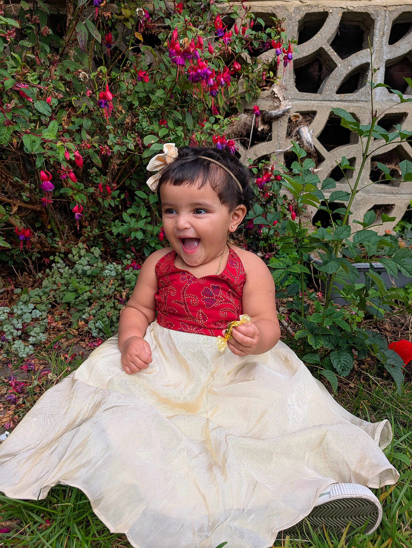 Gianna Tess is registered to the contest to win money with this photo: child, toddler, smiling, dress, grass, flower, greenery, outdoor, happy, candy, headband, nature, person, portrait, sitting, garden, cute, young, celebration, fun