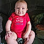 Wyatt is registered to the contest to win money with this photo: baby, blanket, blue_eyes, celebration, child, couch, cute, face, foot, hand, happy, holiday, indoor, infant, pillow, portrait, red_onesie, sitting, skin, smiling