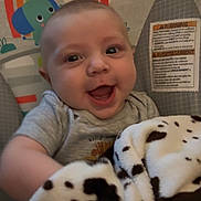 Wyatt joined the competition — help win amazing prizes! animal_print, baby, baby_seat, blanket, cartoon, child, clothing, comfort, cute, fabric, face, happy, indoor, infant, playful, portrait, seat, smiling, toy, young_child