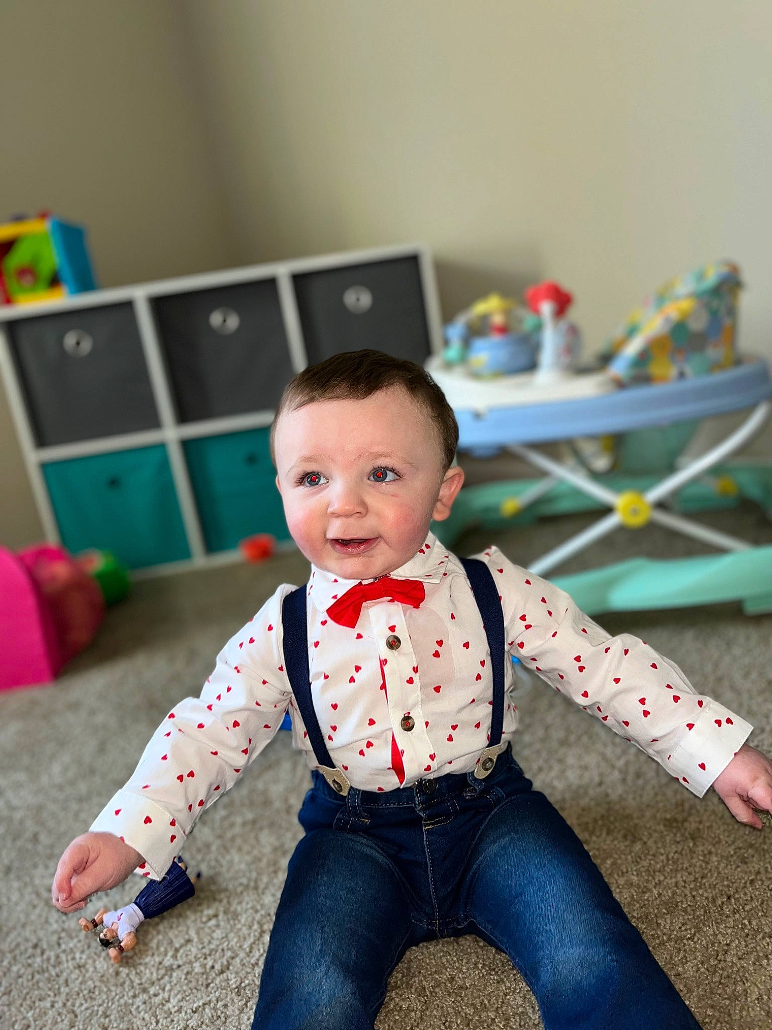 Hayden joined the competition — help win amazing prizes! baby, baby_playing_with_toys, baby_toddler_clothing, child, eye, face, flooring, fun, happy, head, human_body, jeans, leisure, pattern, person, play, sitting, sleeve, smile, toddler