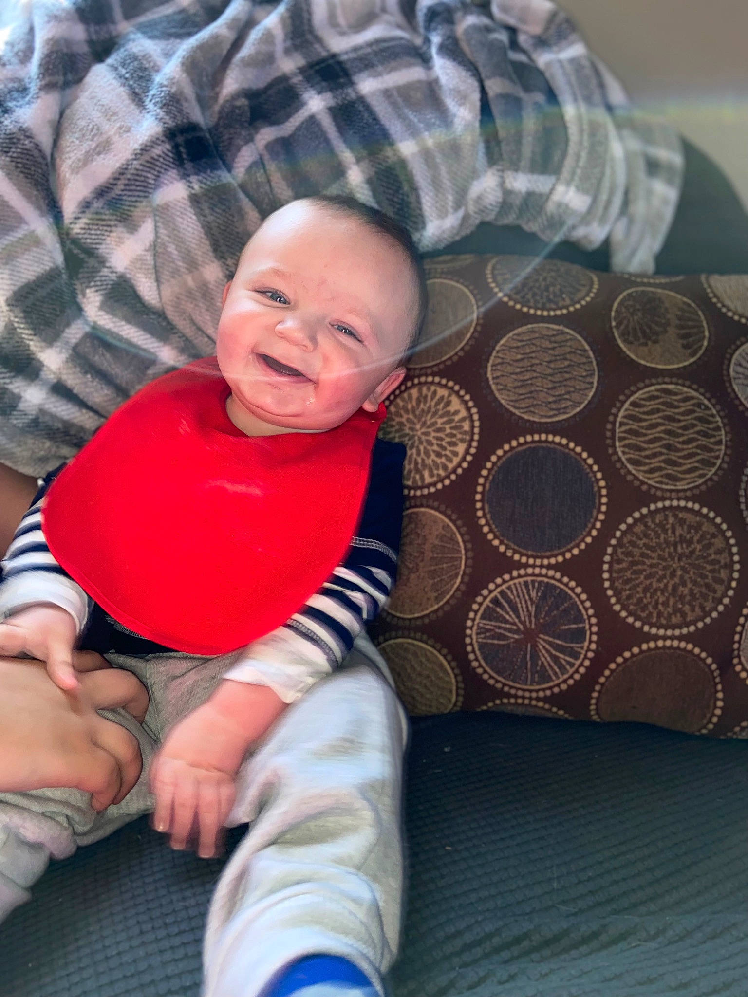 Hayden joined the competition — help win amazing prizes! baby, baby_toddler_clothing, cheek, comfort, eye, finger, foot, happy, knee, lap, linens, pattern, person, plaid, skin, sleeve, smile, tartan, textile, toddler