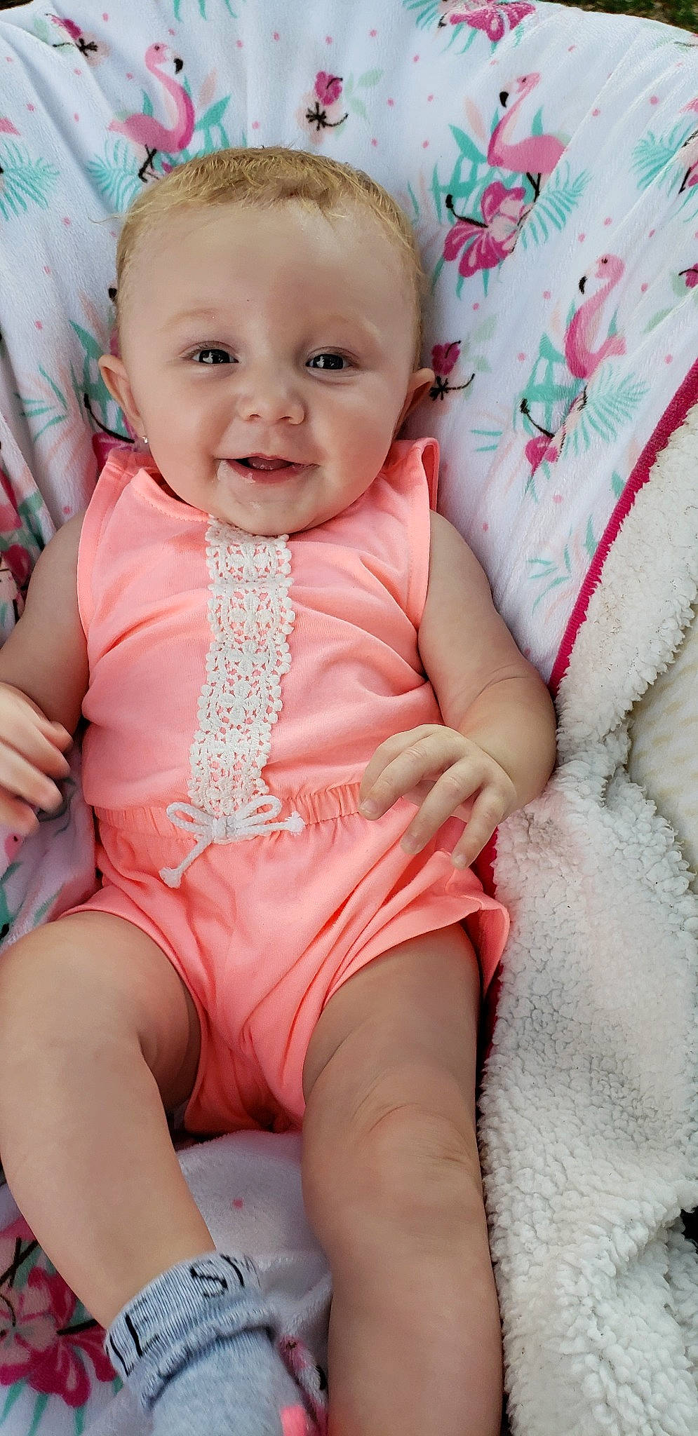 Tinley is registered to the contest to win money with this photo: baby, baby_toddler_clothing, cheek, child, lip, person, pink, sitting, skin, smile, toddler