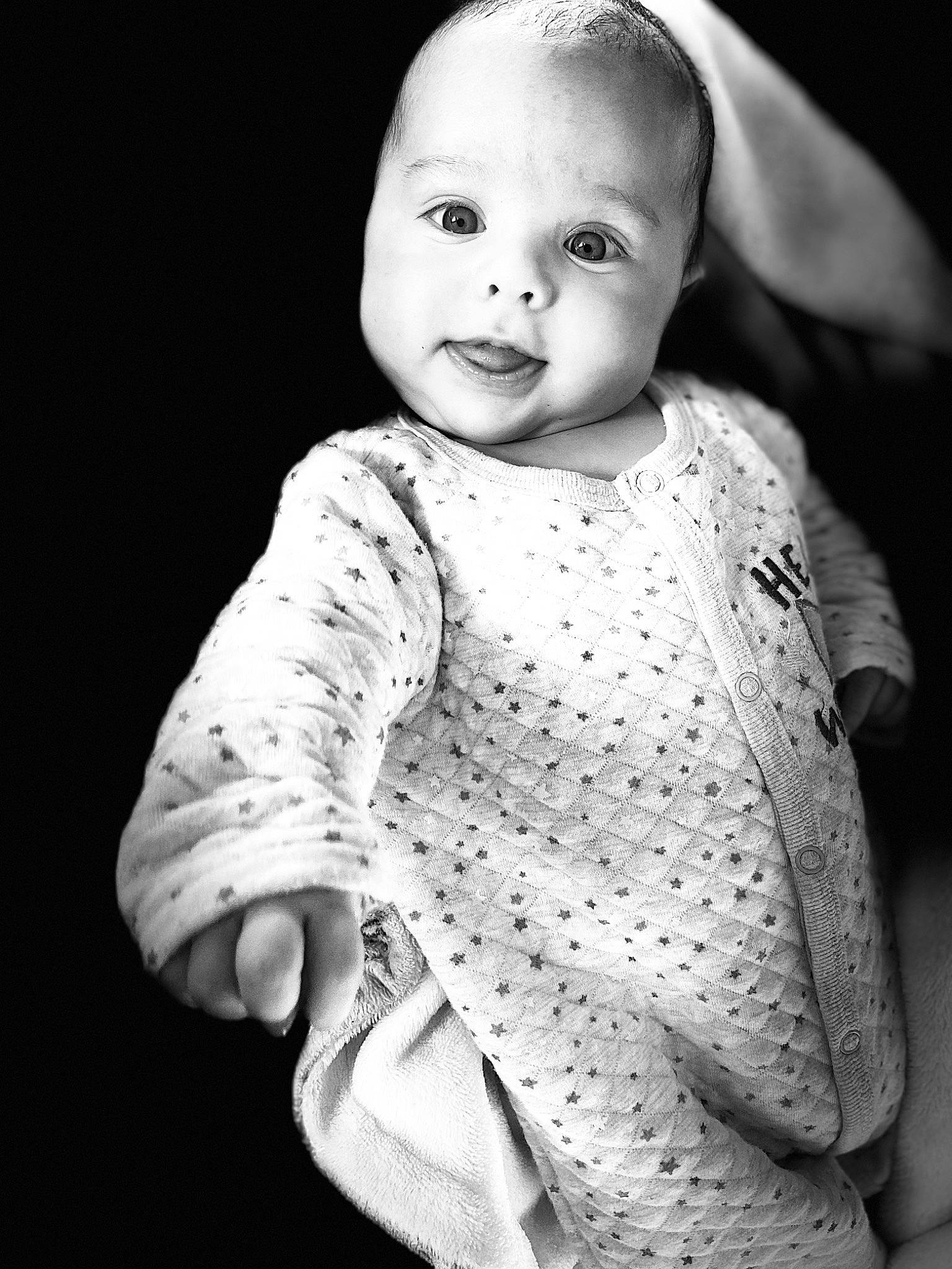 Ezequiel is registered to the contest to win money with this photo: baby, baby_toddler_clothing, beauty, black, black_and_white, cheek, child, collar, eye, finger, flash_photography, gesture, grey, happy, one_piece_garment, pattern, person, sleeve, standing, style