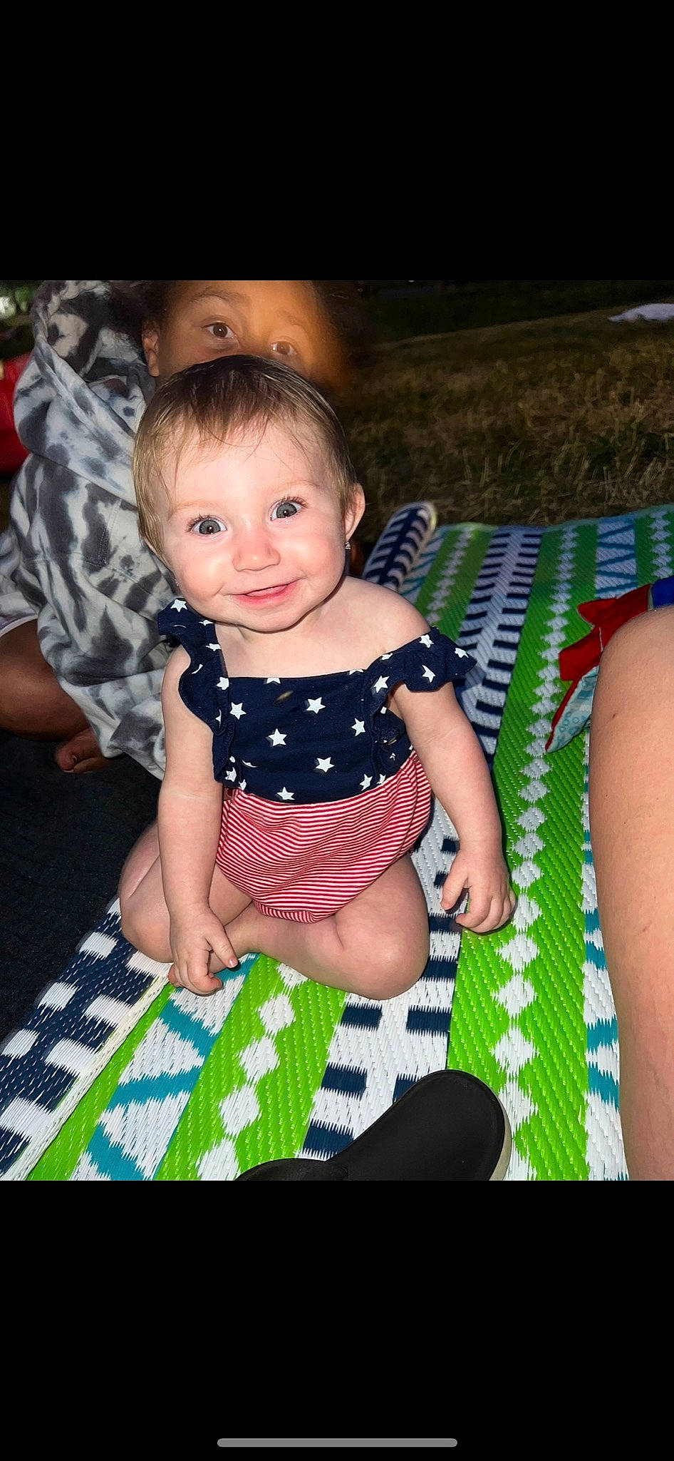 Caliegh is registered to the contest to win money with this photo: baby, baby_toddler_clothing, child, face, flash_photography, fun, grass, hairstyle, happy, head, joy, leisure, organ, pattern, people, person, pink, skin, smile, textile