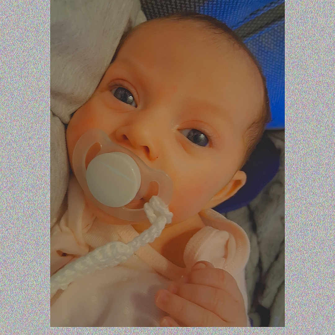 Indaka joined the competition — help win amazing prizes! baby, blanket, child, close_up, comfort, cute, expression, eyes, face, hand, head, indoors, infant, newborn, pacifier, portrait, rest, skin, sleepwear, soft