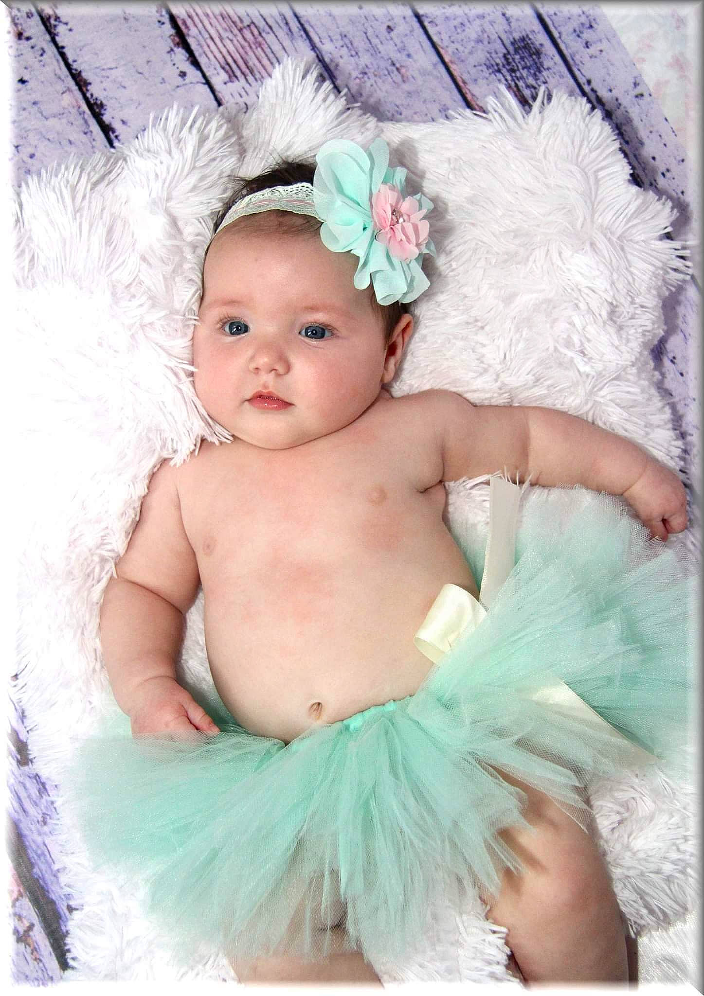 Sarah participe au concours pour gagner de l'argent avec cette photo : aqua, baby, baby_toddler_clothing, child, costume, costume_accessory, costume_hat, embellishment, fashion_accessory, flash_photography, hair_accessory, happy, headband, headgear, headpiece, headwear, iris, jewellery, person, petal