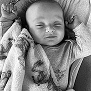 Loan a rejoint le concours — aidez-le/la à gagner de superbes lots ! baby, sleeping, blanket, infant, peaceful, soft, black_and_white, portrait, child, cute, resting, cozy, clothing, closeup, face, hands, indoor, comfort, young, relaxed