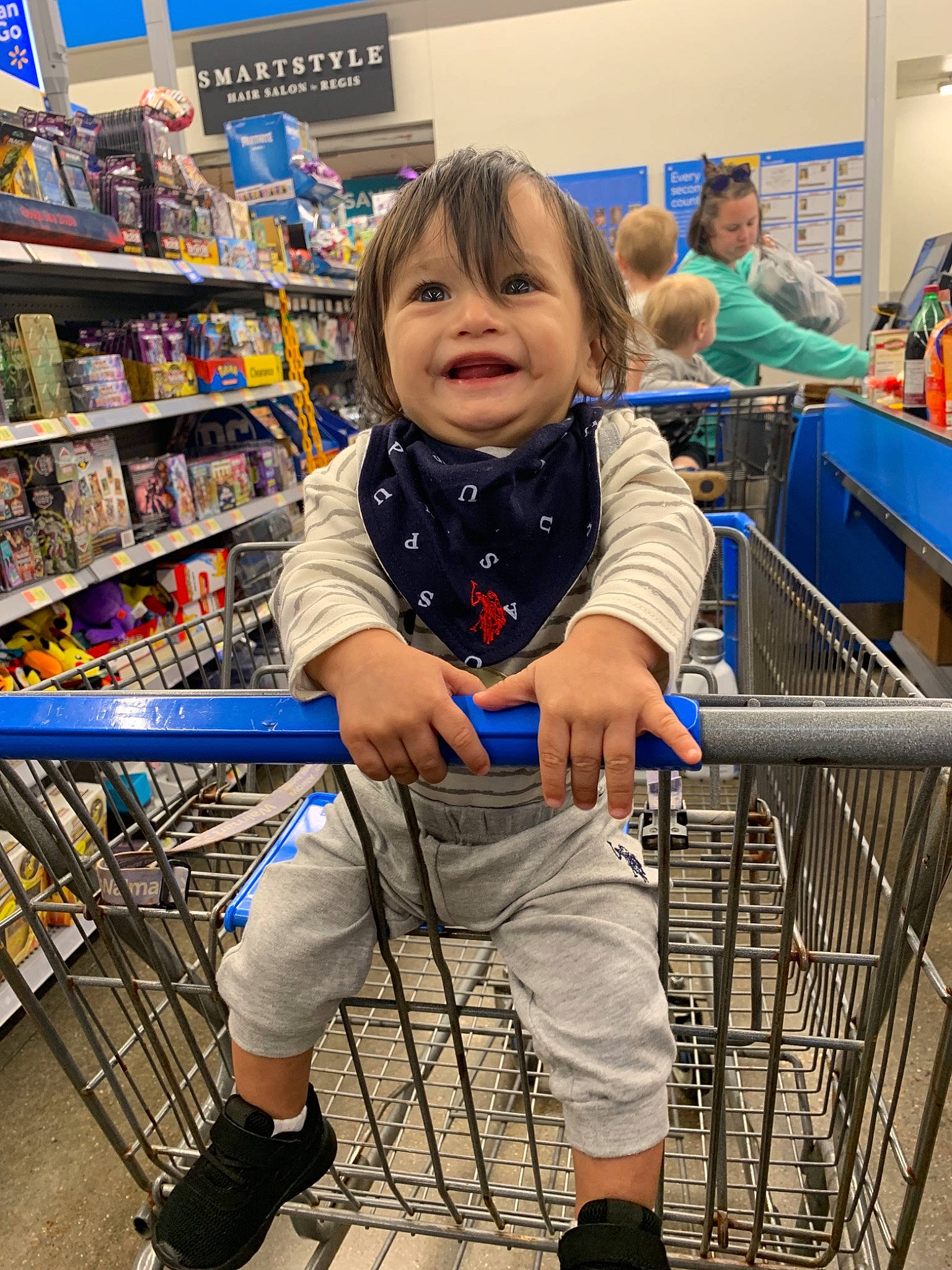Jayse is registered to the contest to win money with this photo: building, business, cart, child, costume, fictional_character, fun, grocery_store, leg, person, product, retail, shoe, shopping, shopping_cart, supermarket, toddler, vacation, vehicle