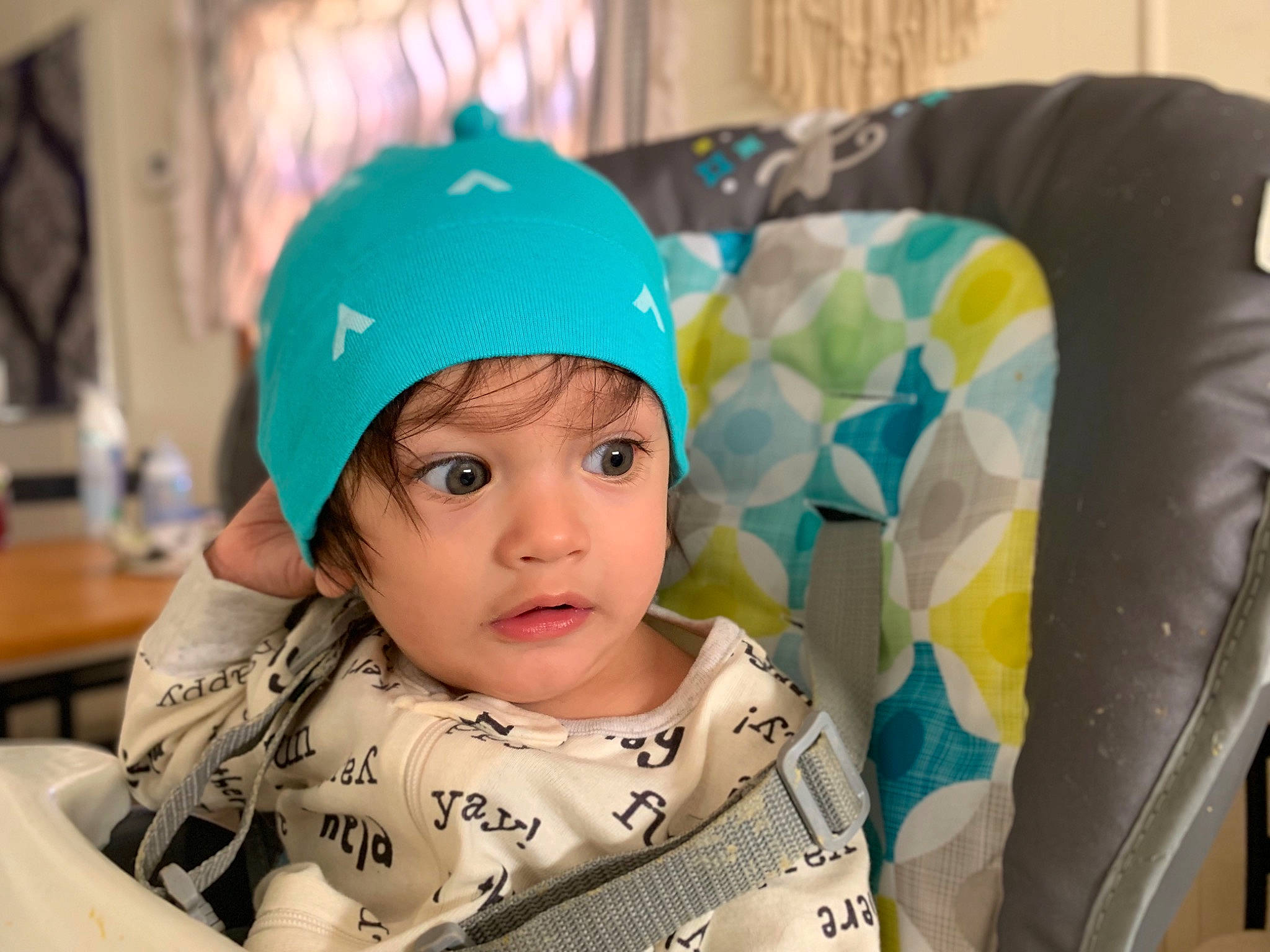 Jayse is registered to the contest to win money with this photo: baby, beanie, bonnet, cap, child, clothing, cool, ear, fashion_accessory, hat, head, headgear, headwear, knit_cap, person, play, smile, snapshot, toddler