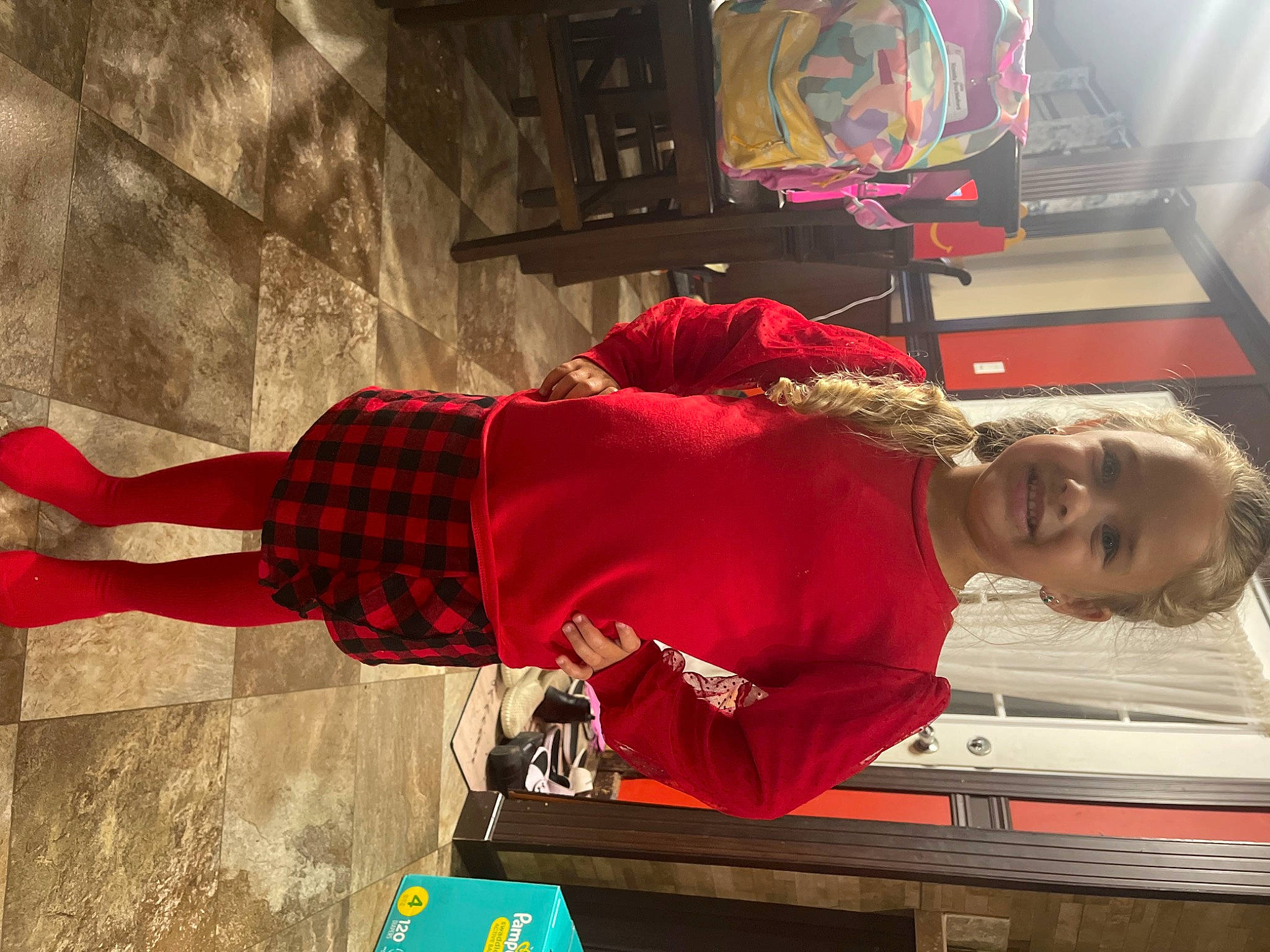 Kassidy is registered to the contest to win money with this photo: art, carmine, flooring, fun, hat, human_leg, joy, pattern, person, plaid, room, smile, t_shirt, tartan, visual_arts, world