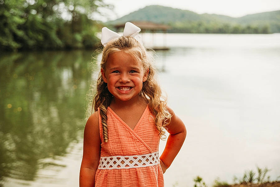 Kassidy joined the competition — help win amazing prizes! bank, daytime, dress, flash_photography, fun, grass, happy, joy, lake, leisure, morning, people_in_nature, person, plant, sky, smile, summer, sunlight, toddler, travel