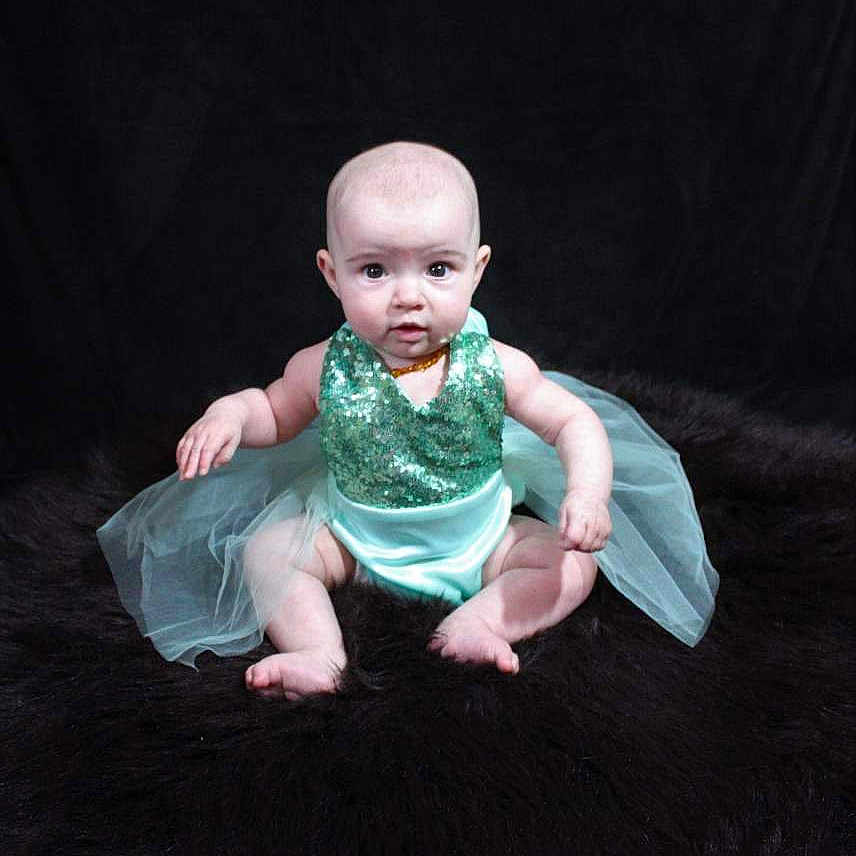 Lilah Reagan joined the competition — help win amazing prizes! baby, ballet_tutu, child, costume, dress, eye, fictional_character, figurine, fun, hand, head, joint, person, pink, portrait, sitting, skin, smile, toddler