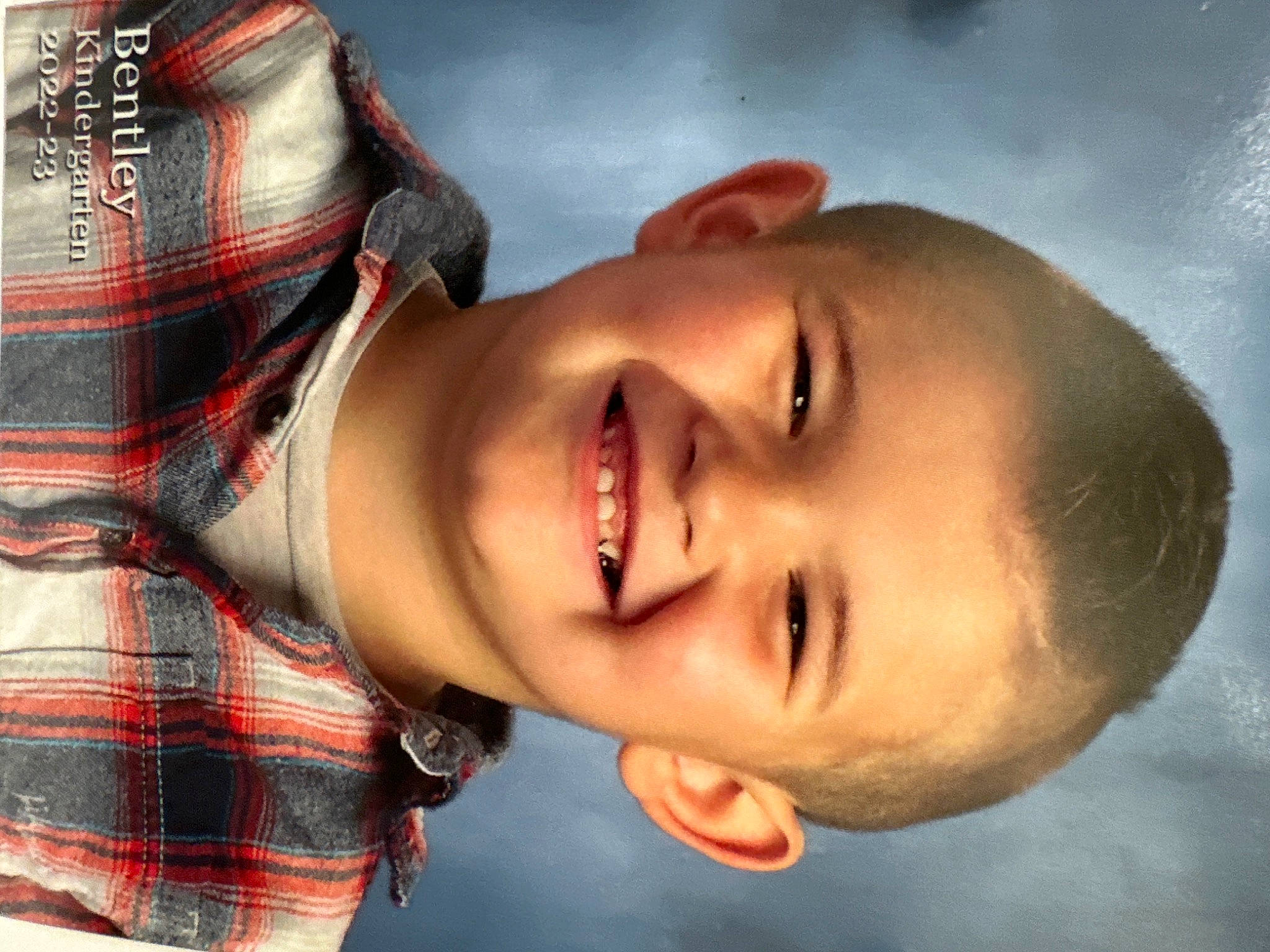 Bentley joined the competition — help win amazing prizes! cheek, eyebrow, eyelash, flash_photography, forehead, gesture, happy, head, headgear, jaw, joy, lip, mouth, neck, nose, organ, person, plaid, skin, sleeve