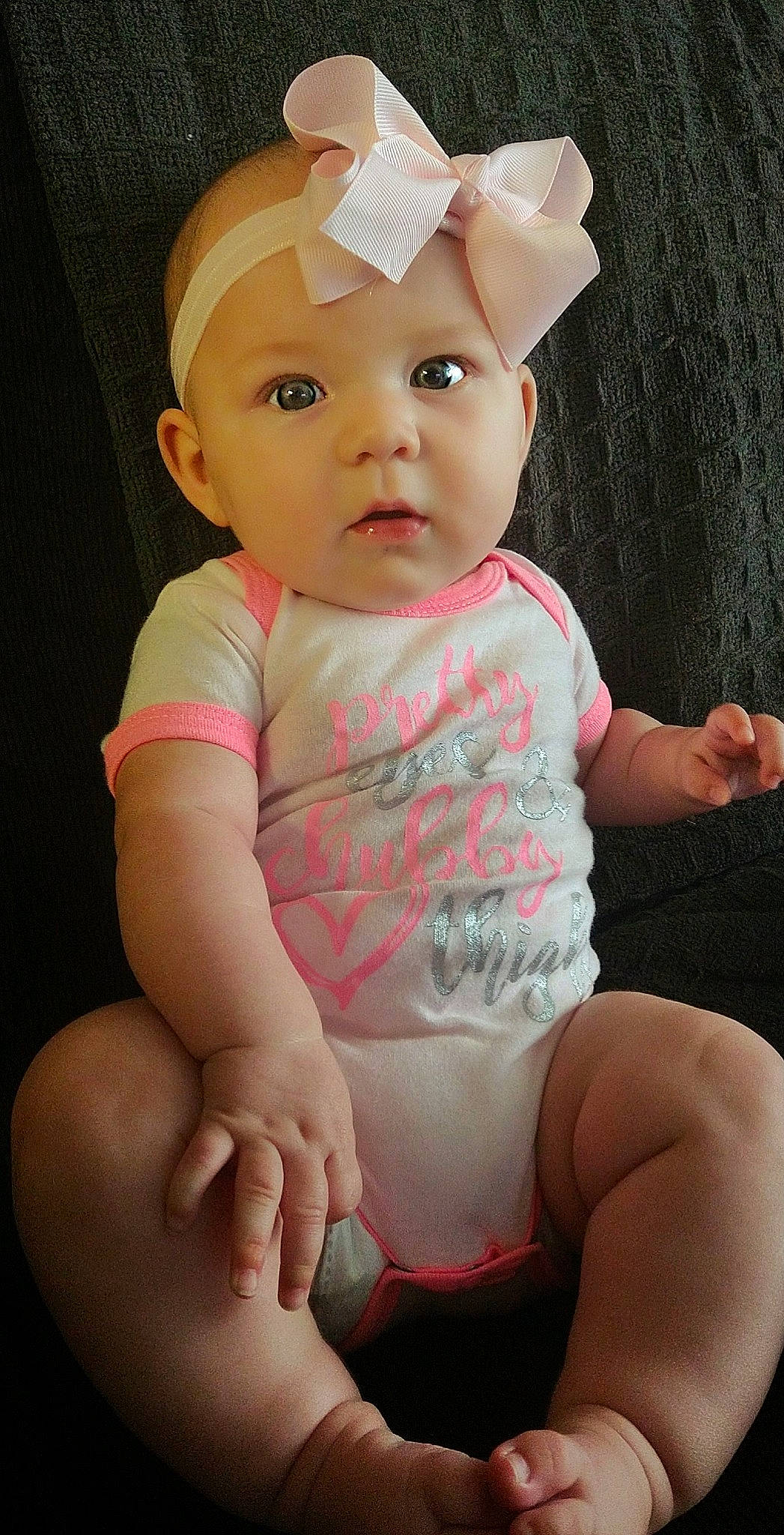 Kirra is registered to the contest to win money with this photo: baby, baby_toddler_clothing, cheek, chin, clothing, eye, head, human, iris, leg, lip, mouth, neck, nose, organ, person, pink, skin, sleeve, stomach