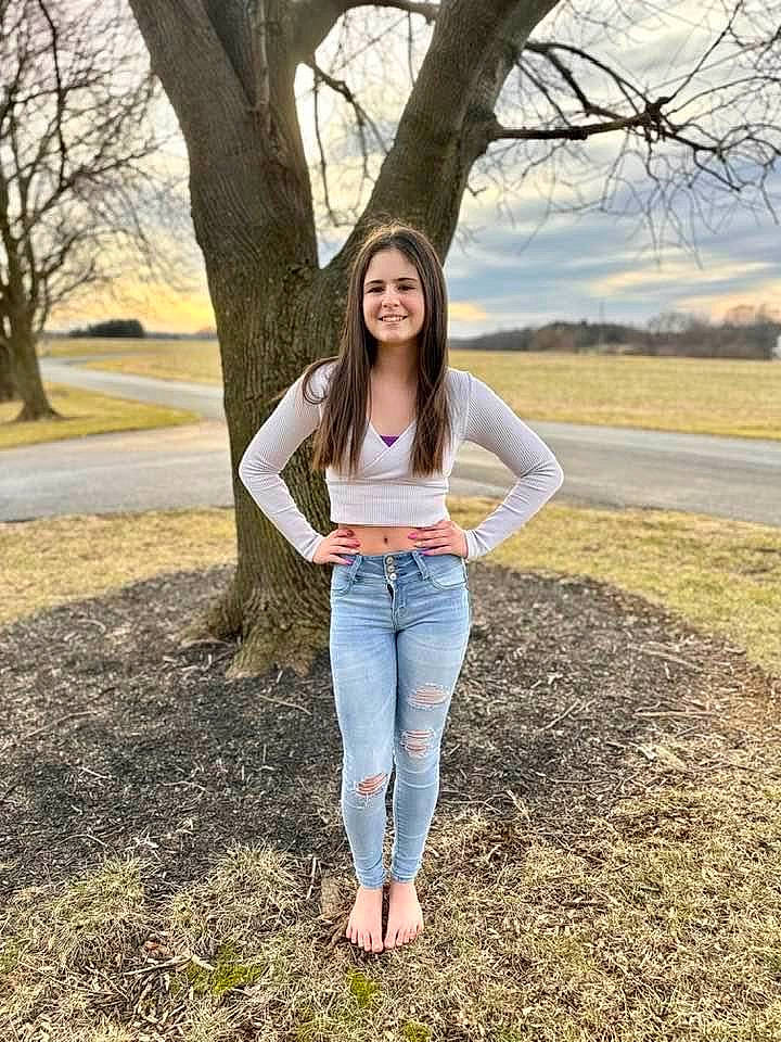 Molly is registered to the contest to win money with this photo: branch, brown_hair, denim, flash_photography, grass, happy, jeans, joy, leisure, long_hair, nature, people_in_nature, person, plant, sky, smile, summer, tints_and_shades, tree, waist