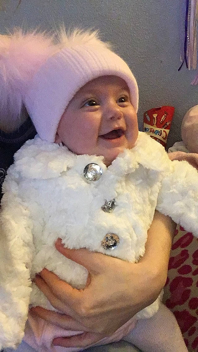 Ella-mae is registered to the contest to win money with this photo: bichon, child, companion_dog, dog_breed, fur, fur_clothing, head, headwear, nose, person, smile