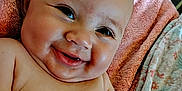 Caityy joined the competition — help win amazing prizes! baby, smiling, cheeks, skin, towel, blanket, infant, happy, cute, portrait, child, laying, indoors, closeup, face, bare_shoulders, expression, relaxed, young, person