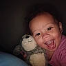 Caityy joined the competition — help win amazing prizes! baby, child, closeup, cuddling, cute, dark_background, expression, face, fun, happy, indoors, joyful, person, pink_shirt, plush_toy, portrait, smiling, stuffed_animal, toddler, warm