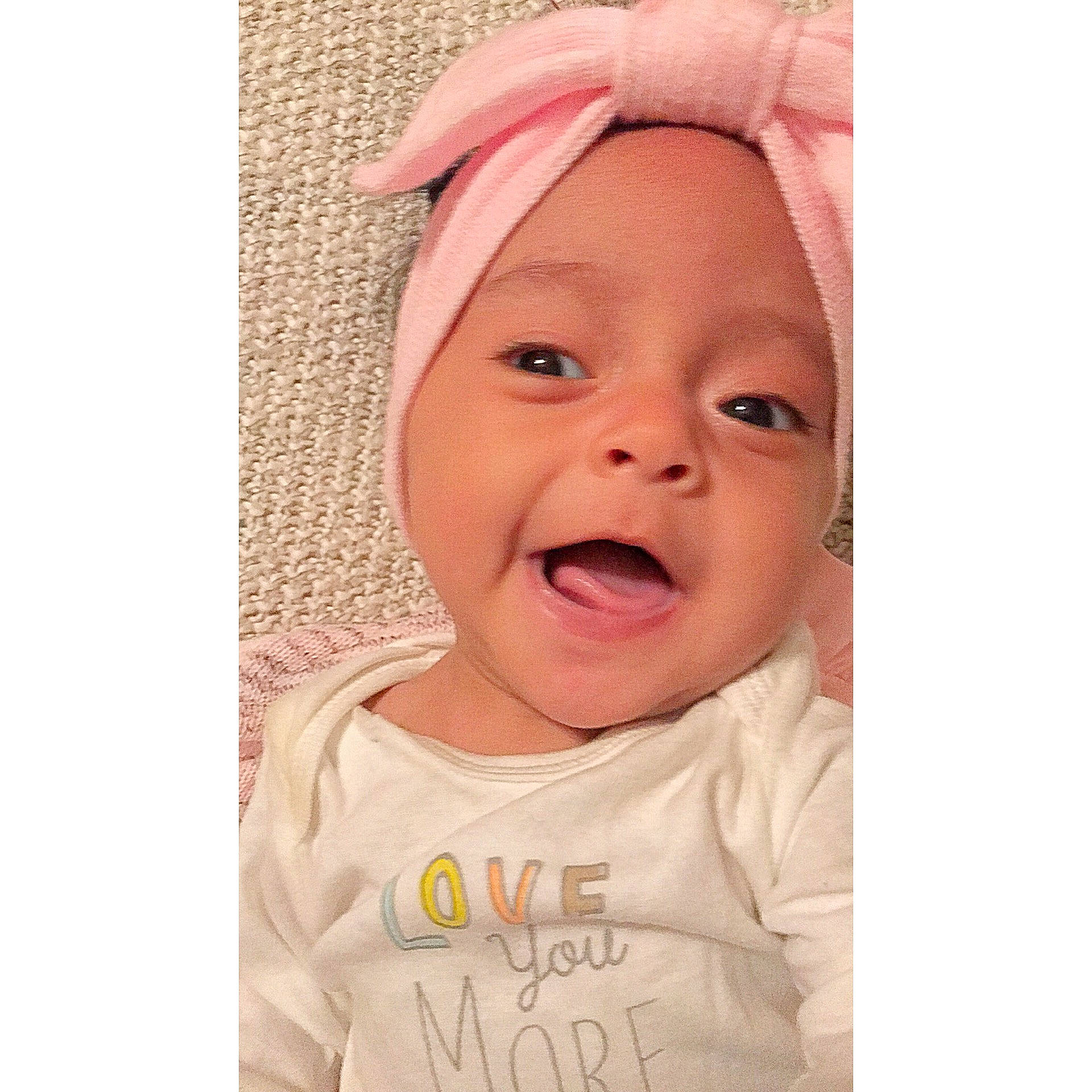 Mila Rose is registered to the contest to win money with this photo: baby, baby_laughing, baby_making_funny_faces, beige, bonnet, cheek, child, ear, face, facial_expression, happy, head, headgear, laugh, lip, nose, person, pink, skin, smile