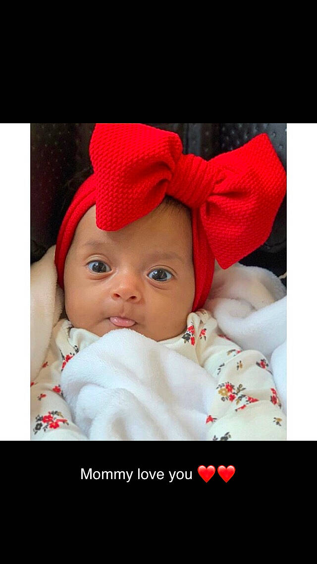 Mila Rose is registered to the contest to win money with this photo: baby, cheek, child, eye, hair_accessory, head, headgear, lip, person, photo_caption, photograph, photography, portrait_photography, red, skin, smile, snapshot, toddler