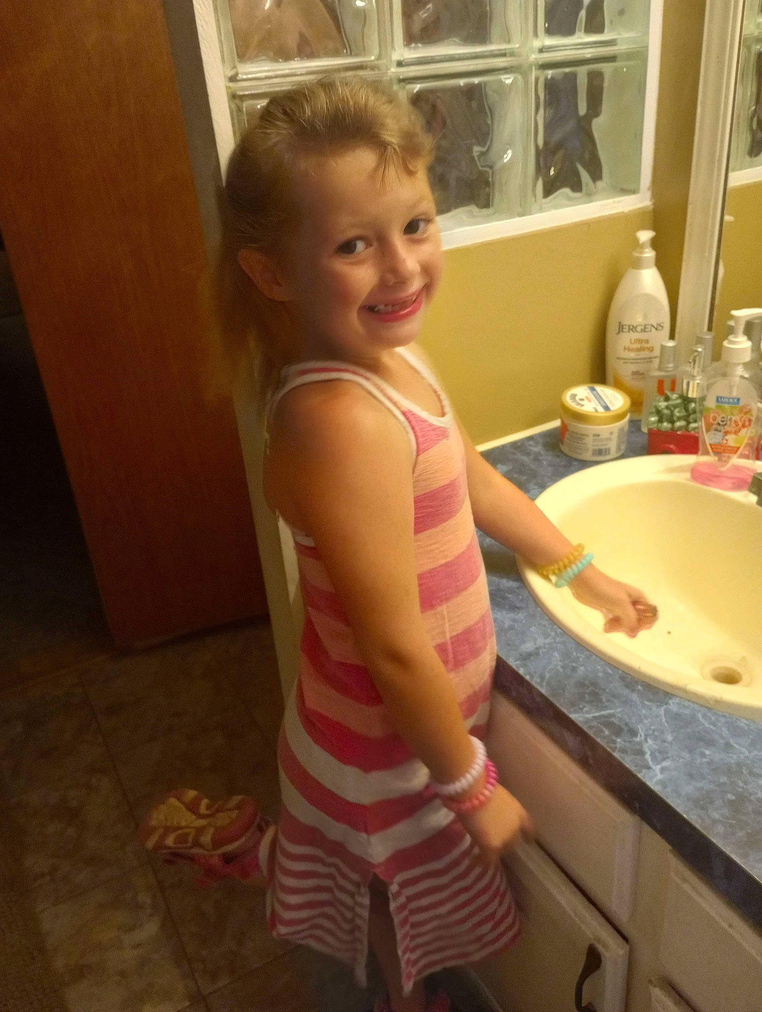 Evelynn is registered to the contest to win money with this photo: bathing, bathroom, bathroom_sink, chest, child, floor, flooring, hardwood, human_leg, joy, person, plumbing, plumbing_fixture, room, sink, smile, tap, thigh, thumb, toddler