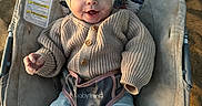 Zinley is registered to the contest to win money with this photo: baby, cap, clothing, coat, face, furniture, hat, head, hosiery, jacket, knitwear, pants, person, photography, portrait, sitting, sock, sweater, transportation, vehicle