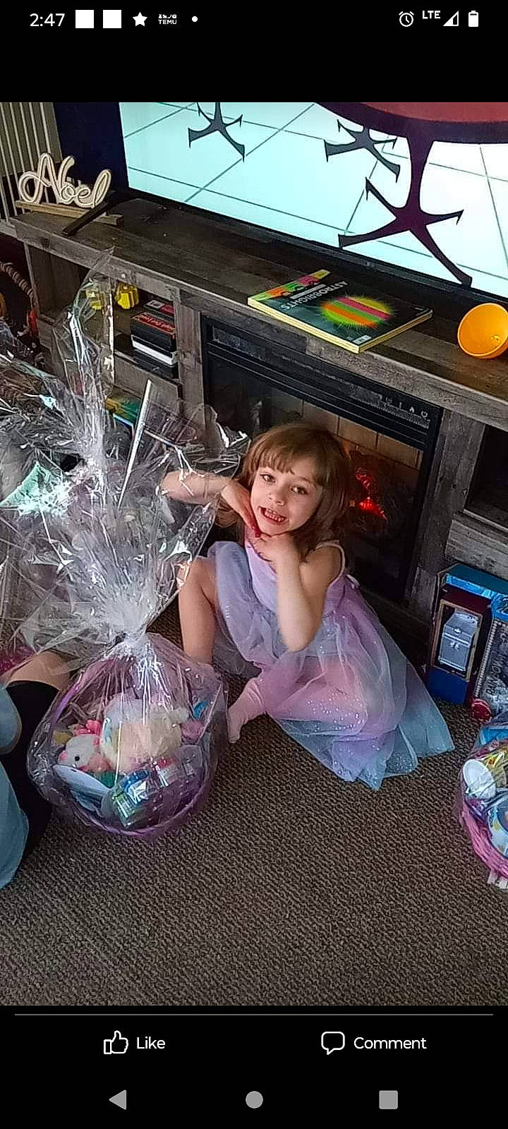 Jazmine is registered to the contest to win money with this photo: basket, child, easter, event, fun, glass, happy, holiday, joy, lap, leisure, party, person, play, purple, recreation, sitting, smile, toddler, tree