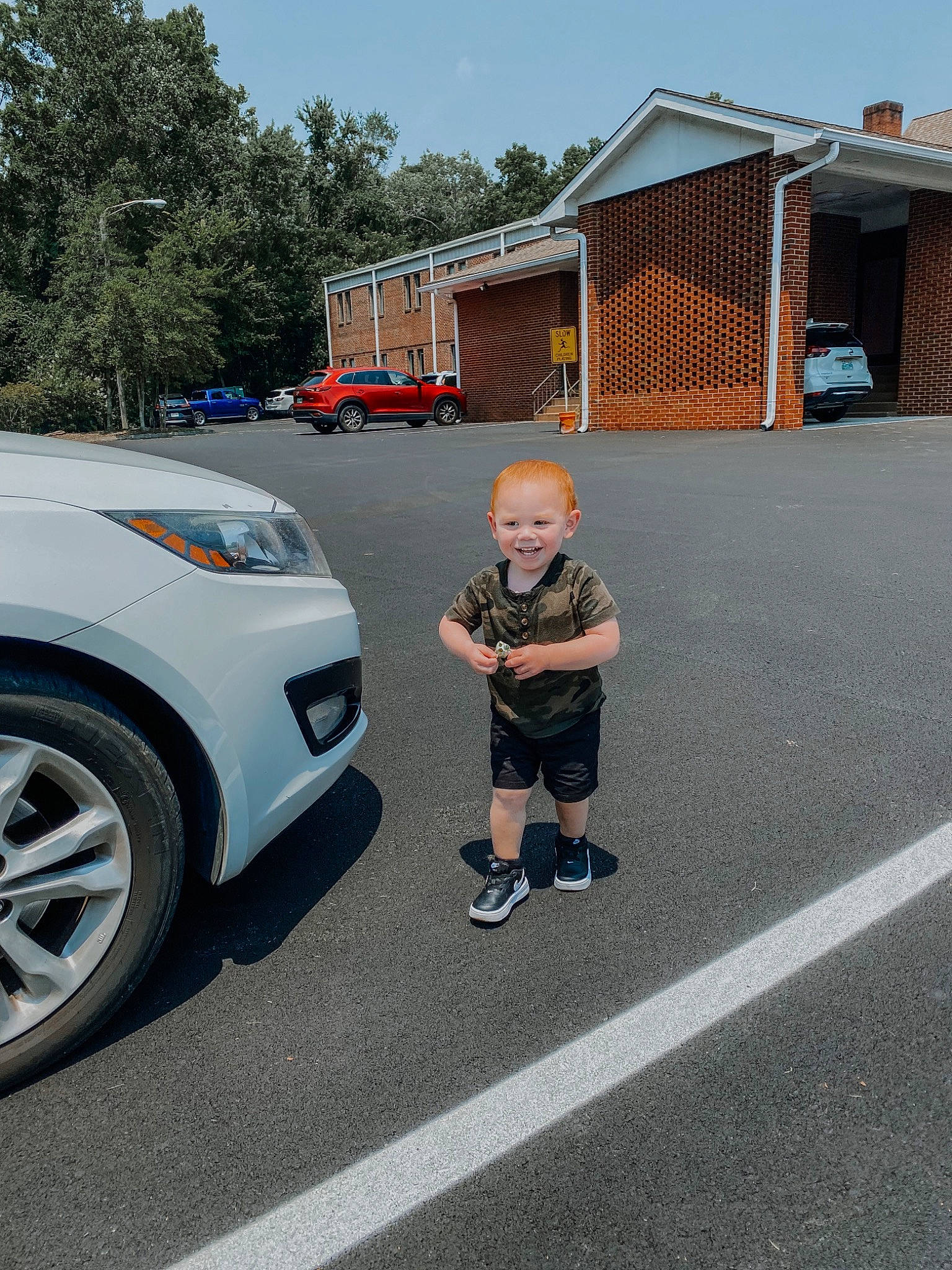 Cannon is registered to the contest to win money with this photo: alloy_wheel, asphalt, automotive_design, automotive_exterior, automotive_fog_light, automotive_lighting, automotive_tire, bumper, car, fender, hood, joy, motor_vehicle, person, personal_luxury_car, rim, rolling, sky, tire, vehicle