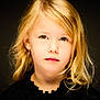 beautiful, black_clothing, blonde_hair, child, close_up, curly_hair, earrings, expression, face, fashion, girl, green_eyes, head_and_shoulders, innocent, looking_at_camera, portrait, serious, soft_lighting, studio_photo, young_child