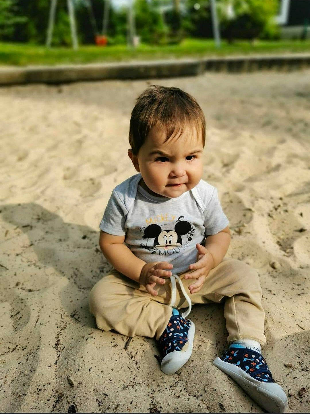 Matei is registered to the contest to win money with this photo: baby, baby_toddler_clothing, child, eye, fun, grass, happy, leisure, people_in_nature, person, plant, recreation, sand, shorts, sitting, skin, smile, soil, toddler, tree