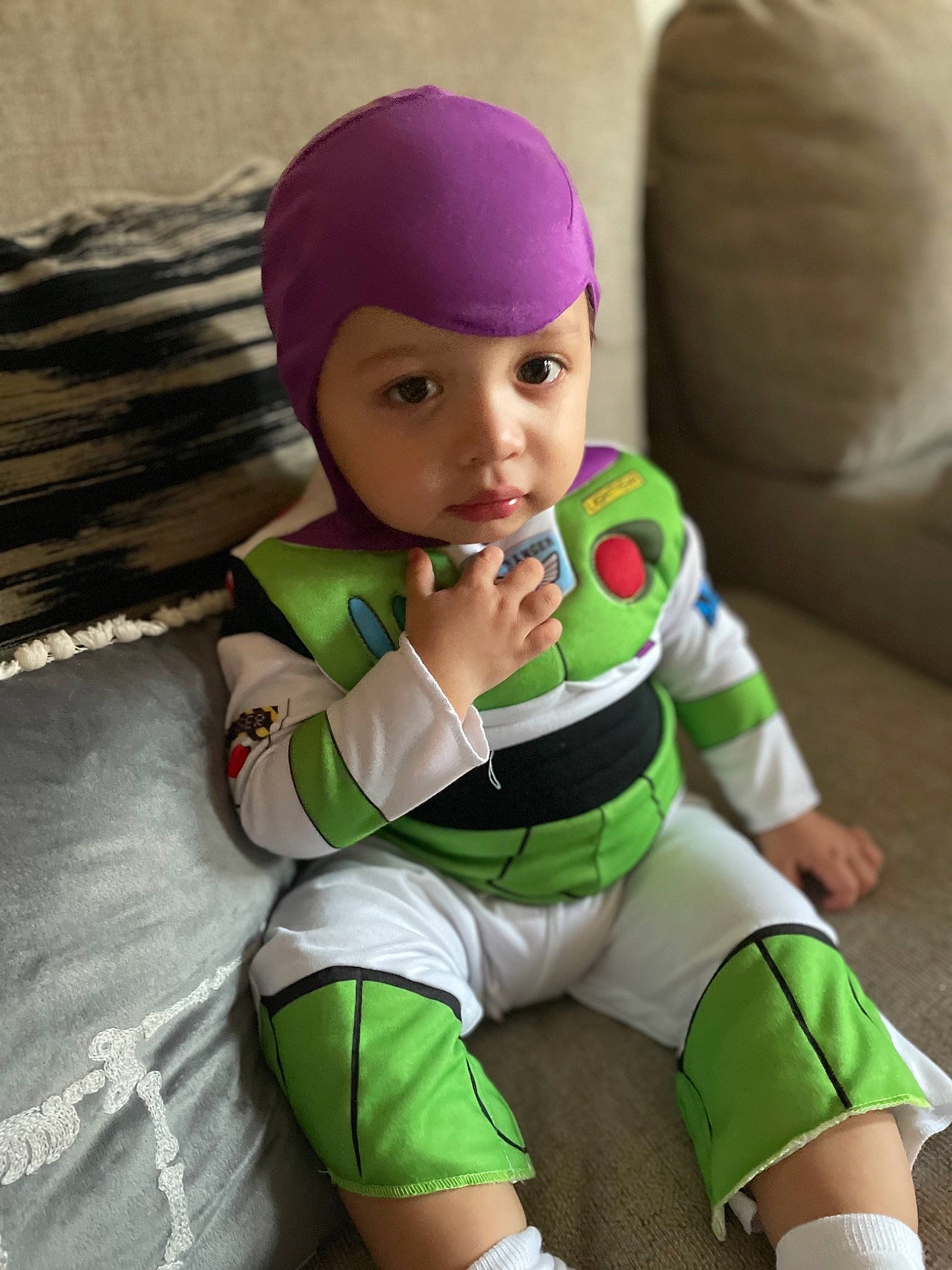 Victor is registered to the contest to win money with this photo: baby, baby_toddler_clothing, cap, child, comfort, doll, eye, fictional_character, happy, head, headwear, human_leg, knee, person, personal_protective_equipment, sleeve, sock, textile, thigh, thumb