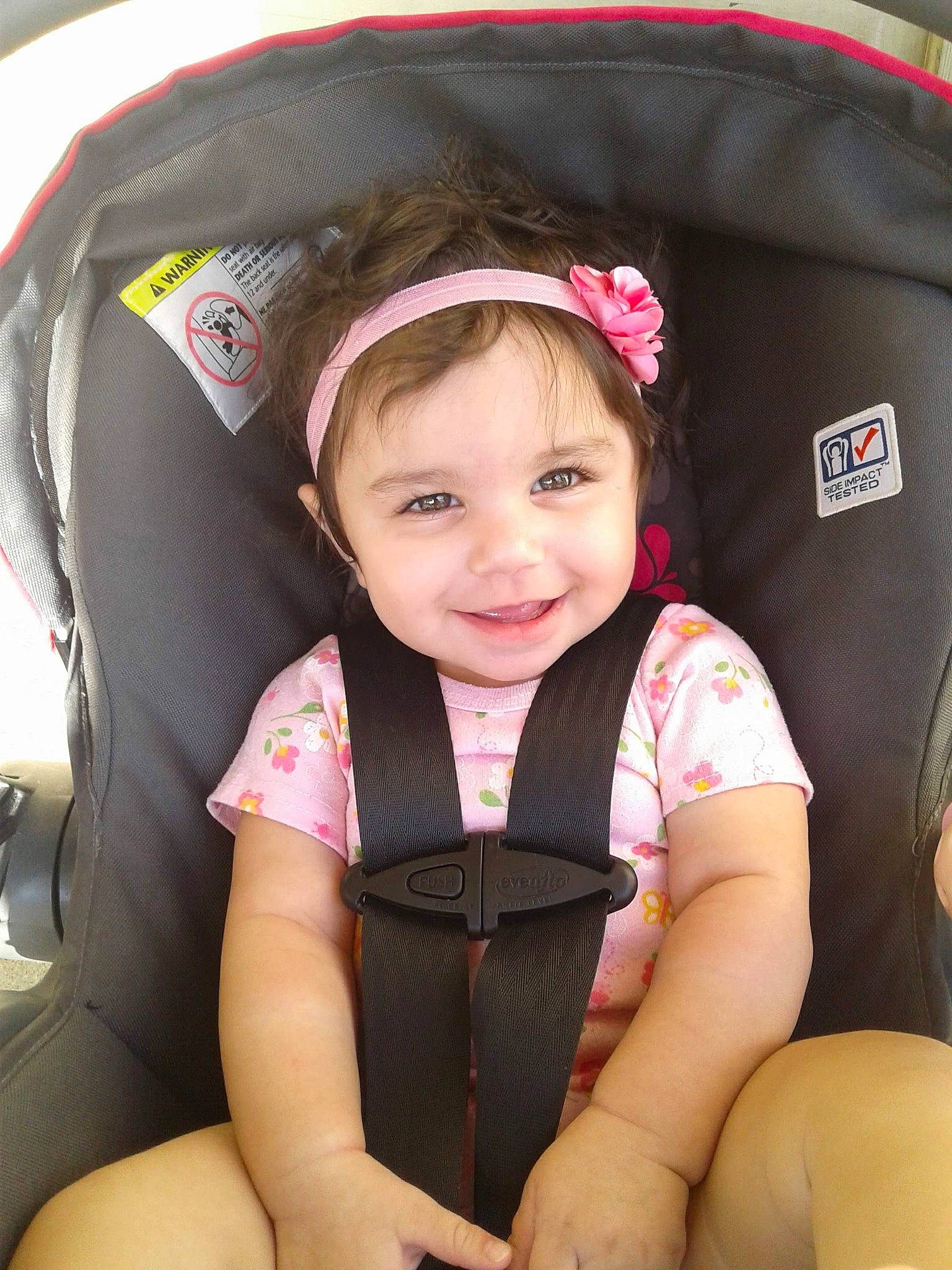 Mckayla is registered to the contest to win money with this photo: auto_part, baby_carriage, baby_in_car_seat, baby_products, car_seat, car_seat_cover, child, joy, person, product, seat_belt, steering_wheel, toddler