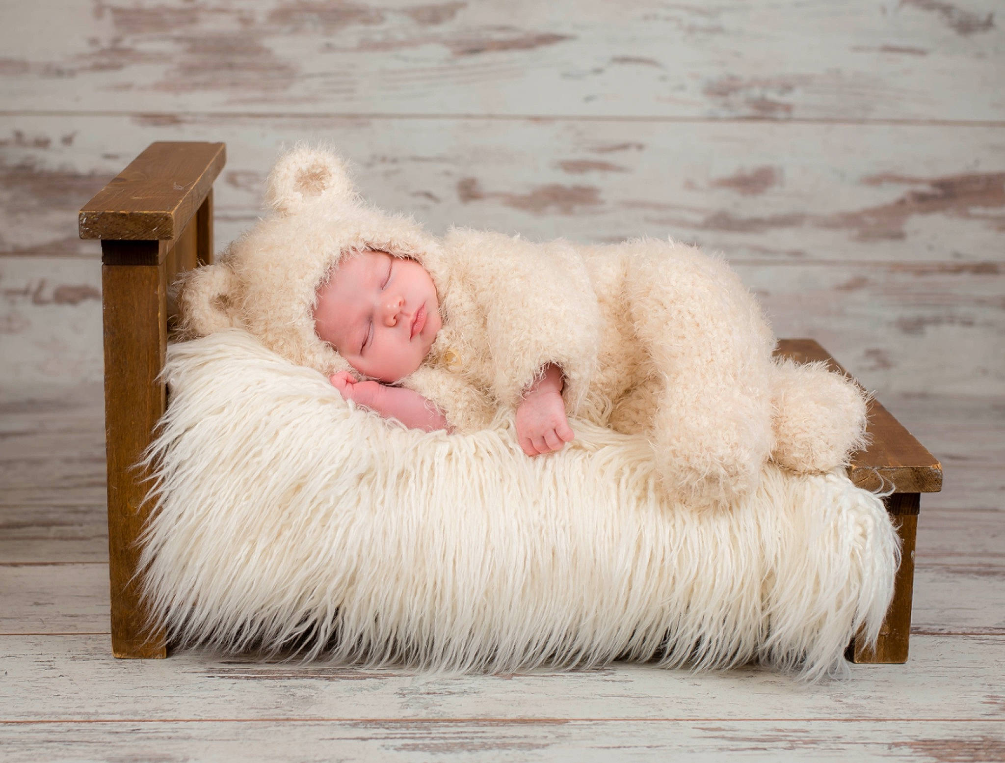 Bryson is registered to the contest to win money with this photo: art, baby, baby_toddler_clothing, comfort, dress, feather, flooring, fur, fur_clothing, grey, happy, linens, person, portrait_photography, sitting, smile, toddler, toy, wood, wool