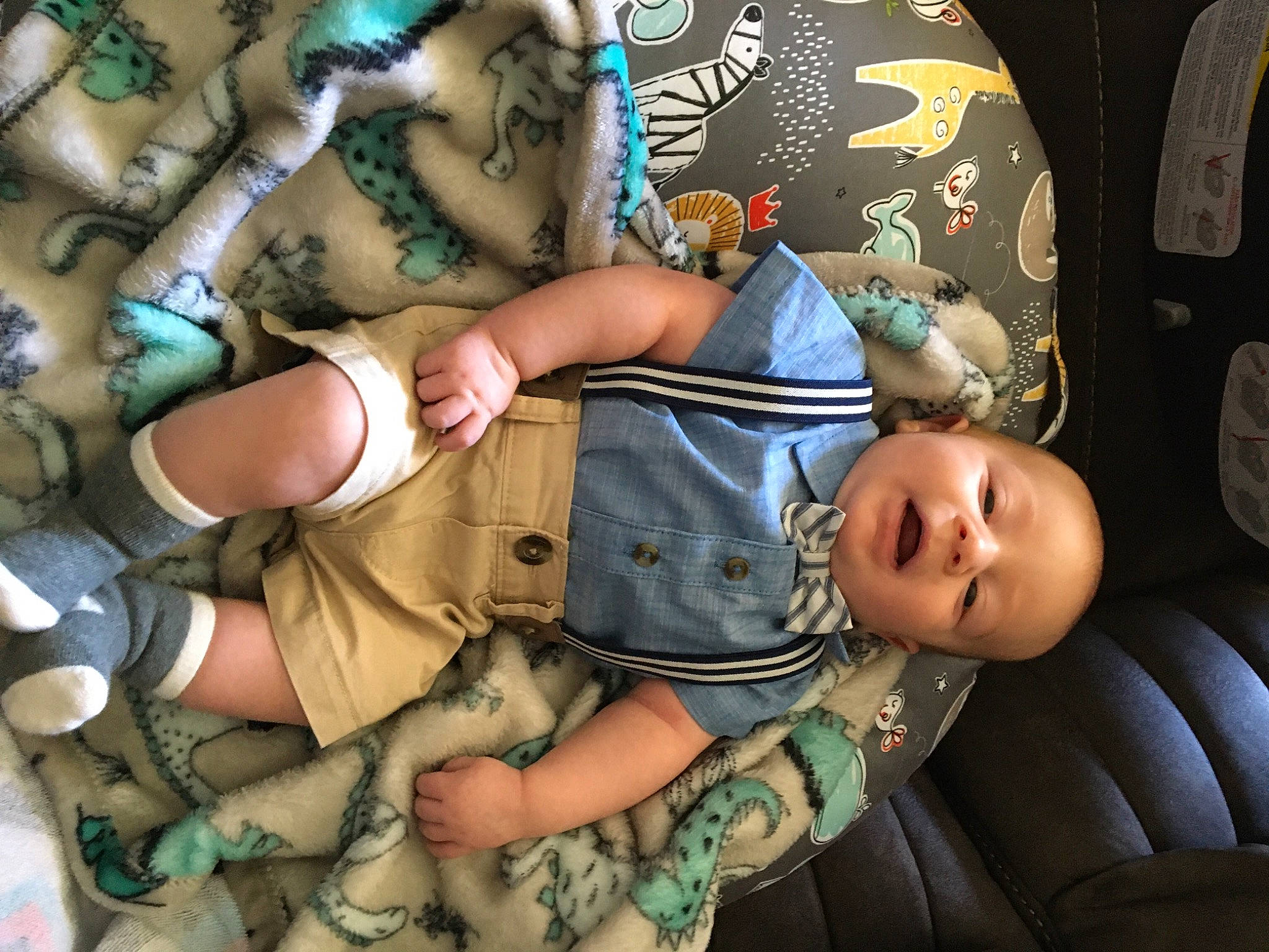 Zander is registered to the contest to win money with this photo: arm, baby, camouflage, comfort, elbow, finger, gesture, glasses, hand, human_leg, joint, marines, military_camouflage, military_person, military_uniform, nail, pattern, person, sleeve, thigh
