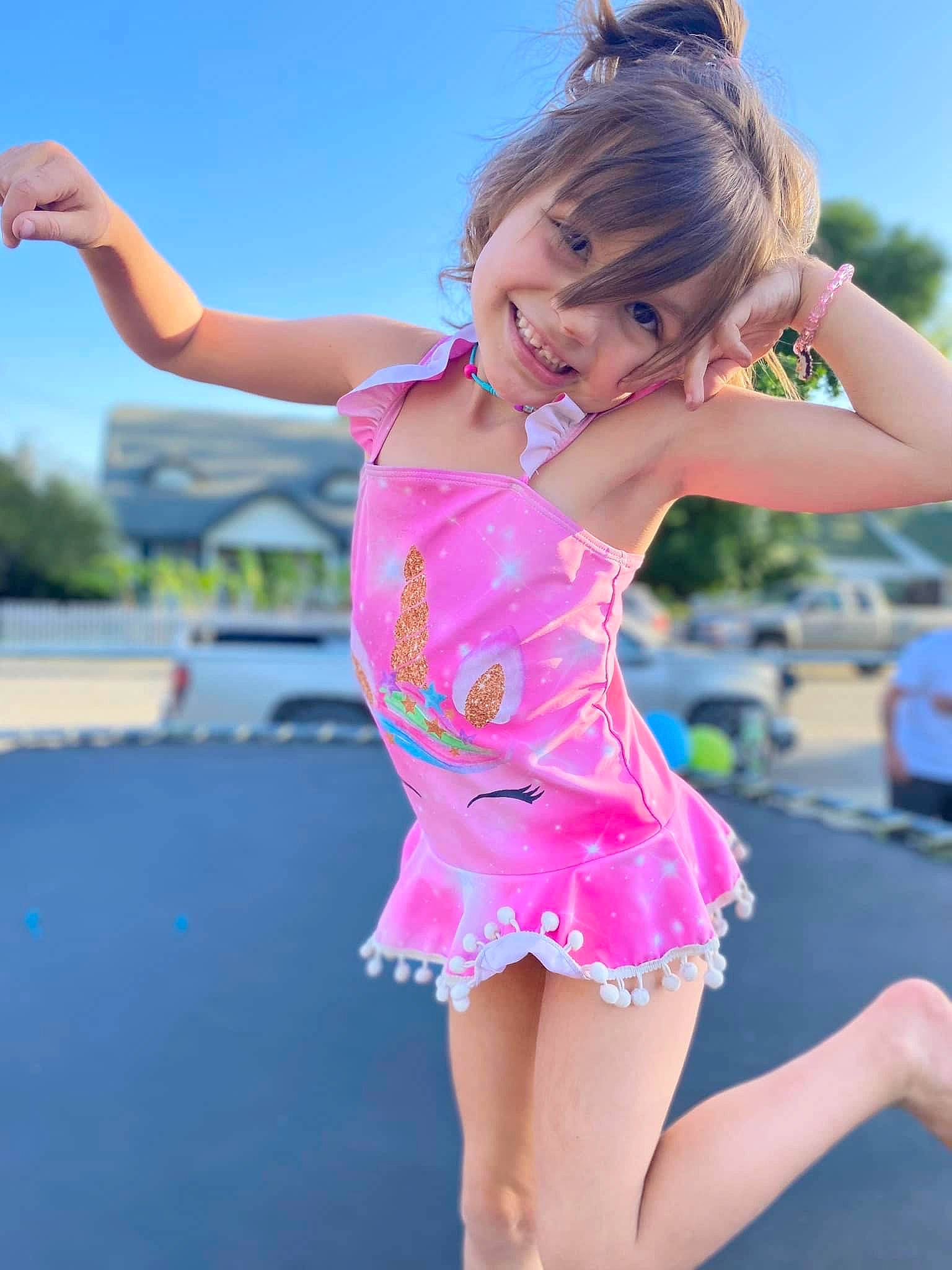 Hailey is registered to the contest to win money with this photo: blond, child, dance, electric_blue, event, fun, happy, human_leg, joy, leisure, magenta, performing_arts, person, pink, recreation, shoulder, sky, smile, summer, thigh